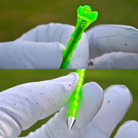 Close-up of Forever Tee Premium Metal Unbreakable Golf Tees 2 Pack With Extended Metal Tip held by gloved hand