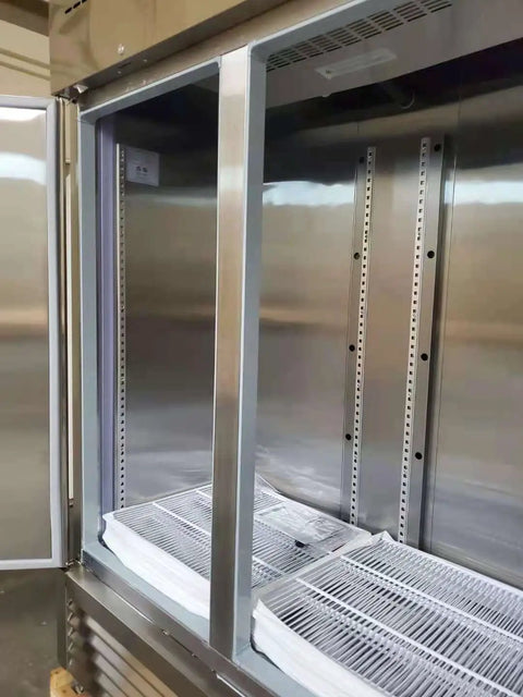 Inside view of Rock Solid 82 Inch Wide Commercial Reach In Freezer With Three Doors And 72 Cubic Feet Capacity Stainless Steel.