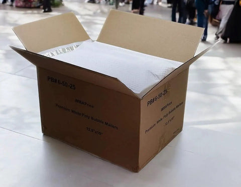 Open cardboard box containing 12.5 By 19 Inch White Poly Bubble Mailers Self Seal Padded Packing Envelopes, 100 Pack, Large Size
