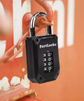 Gym Locker Lock With 4 Digit Combination, Tough As Nails Padlock, Hardened Stainless Steel attached to a metal gate, black.