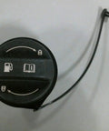 Kia Fuel Filler Cap Assembly OEM Direct Fit Replacement, visible symbols, top view, black plastic cap