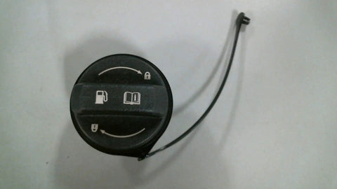 Kia Fuel Filler Cap Assembly OEM Direct Fit Replacement, visible symbols, top view, black plastic cap