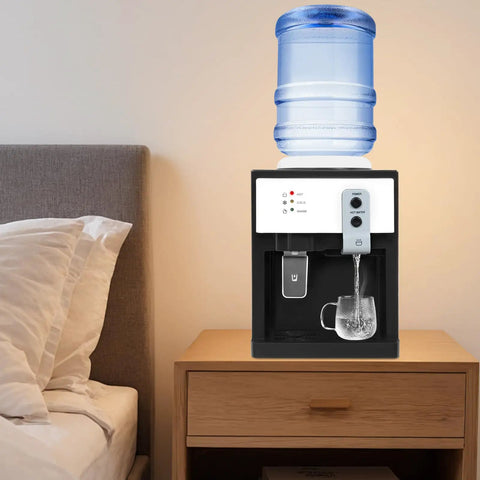 Top Loading Hot And Cold Desktop Water Dispenser With 500W Heating And 75W Cooling Delivers 1.32 Gal Per Hour Hot Water 110V US Plug White Water Cooler on a bedside table