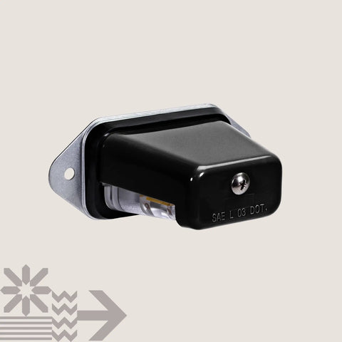 Black LED license plate light, surface mount, designed for boats, trailers, cars, waterproof, DOT SAE L compliant.