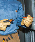 Technician holding Pro Grade Dope Insulated Screwdriver Set With Flip Blade For Square Tips Number One And Number Two Double Ended