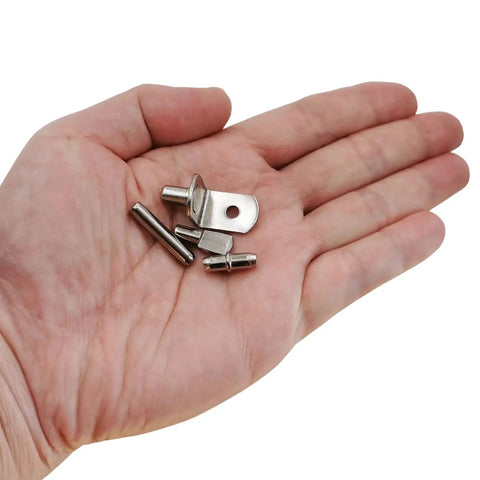 Super Sturdy 5mm Shelf Support Pegs 94 Piece Kit With Four Game Changing Designs To Upgrade Your Closet Bookcase And Home Storage Setup In No Time Flat, nickel iron pegs in hand.