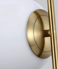 Close-up of Dope 2 Light Globe Pendant Lighting with white glass shade and brass gold metal accent
