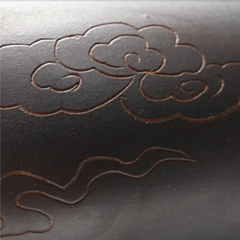 Close-up of USZWBY Modern Round Vessel Vanity Sink Above Counter Basin ceramic wash counter, featuring elegant cloud designs.