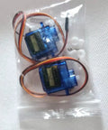 Micro RC Servo Motor Kit For Robots And Drones, 360 Degree Steering Gear, servo motors in a plastic package with wires visible
