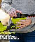 User demonstrating quick swap feature on Heavy Duty 18V Cordless Grass Shear And Shrubber Trimmer for versatile use.