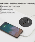 Keep Your Desk Legit Tidy With This 3.15 Inch Flush Mount Power Grommet Featuring Usb C Pd 20W And Usb A 10W Ports For Hella Quick Thirty Watt Fast Charging Any Day on a desk with a smartphone.