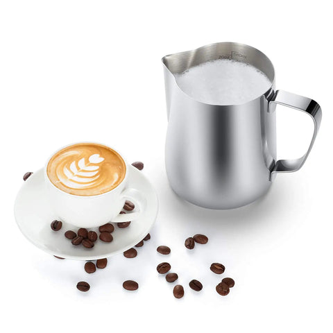 20oz Stainless Steel Milk Frothing Pitcher With Latte Art Pen For Home Espresso Machines And Coffee Bars next to a latte