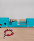 Compact Wood Lathe Machine Featuring 96 Watt Copper Motor Adjustable 4000 To 9000 Rpm Speed Aluminum Build and Dead Simple Controls for Reliable Polishing Grinding and Bead Turning Jobs with red bead necklace.