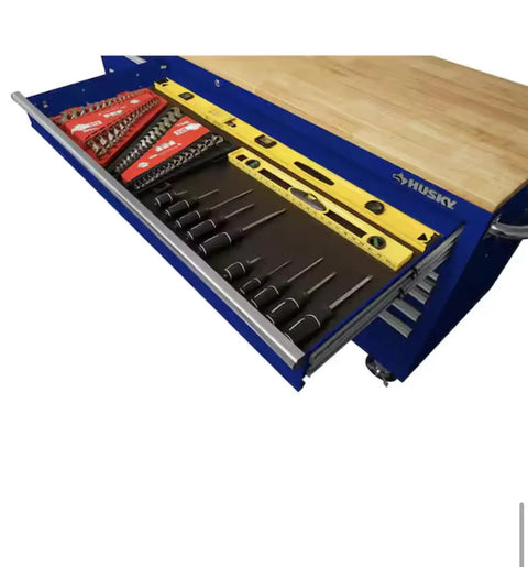 Badass 72 Inch Wide Mobile Workbench Tool Chest With Solid Wood Top Integrated Power Strip And 18 Hella Spacious Drawers For Rock Solid Gloss Blue Garage Storage showing organized tools in a drawer.