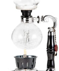 Close-up of Three Cup Tabletop Siphon Coffee Maker With Alcohol Burner gravity brewing, featuring vacuum seal technology.