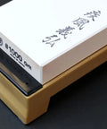 Pro Grade Japanese Whetstone Sharpener 1000 Grit Water Stone with yellow base on black background