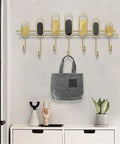 Top Shelf Nordic Iron Wall Hooks Zero Drilling Installation for Slings Your Coats Towels Keys and Bags Heavy Duty Metal Organizer mounted with a bag.