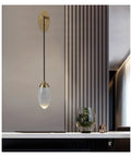 Premium Copper Wall Sconce Featuring Sparkling Crystal Accent Shades With Soothing Warm Led Glow For Contemporary Bedroom And Corridor Spaces, mounted above a sleek table with plants.