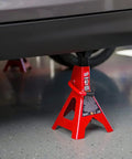 3-ton red Torin BIG RED steel jack stand under a car, single unit