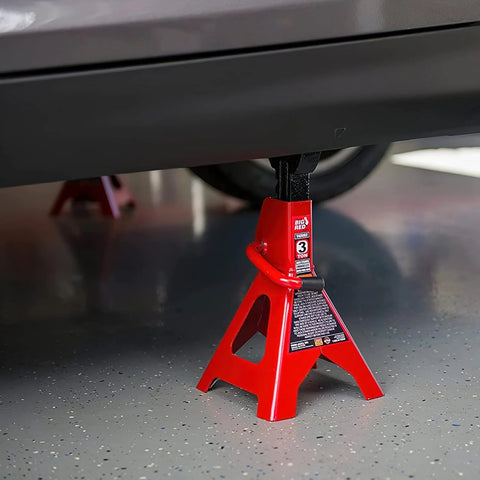 3-ton red Torin BIG RED steel jack stand under a car, single unit