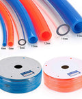 Works Like A Champ 12 Mm Polyurethane Pneumatic Hose Tube For Air Compressor And Beverage Transfer 80 Meter Long orange and blue flexible hoses displayed on coils.