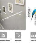 Heavy-Duty Wrought Iron Handrail And Safety Bar With Rock-Solid Rust Resistant Finish For Indoor Outdoor Stairs Support Banister Wall Railing Grab Handle For Elderly Kids Easy Install Kit 9.2Ft mounted on gray wall with artworks.