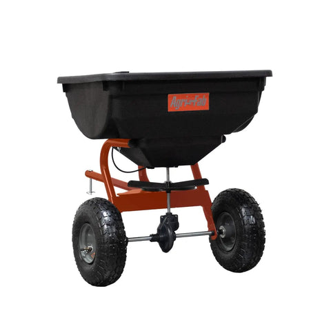 Tow Broadcast Spreader 85 lb capacity for lawns, features 10 inch pneumatic tires, cable flow control, made in USA