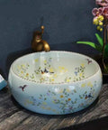 Bathroom Vessel Sink, Countertop Basin Bird Kitchen Basin Sink, Ceramic Sink with flower art, round design, on countertop.