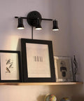 Industrial Track Lighting Kit With Adjustable 3-Light Brass Lamp Holders above framed art on a wall-mounted shelf