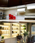 Kitchen and bookshelf lit with Led Dimmable Under Cabinet Lighting Kit With Hand Wave Activation, Motion Sensor, Touchless Dimming, Warm White 6 By 12 Panels, Easy Install, Memory Brightness, Cool White Option.