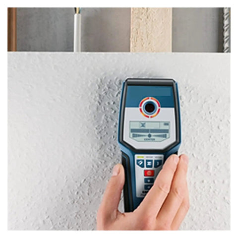 Heavy Duty Digital Stud Finder Wall Scanner with precise detection controls in hand, scanning a wall for hidden objects.