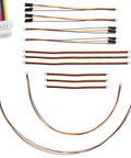 Qwiic I2C Cable Kit With Stemma QT Wires Includes 12 Color Coded Cables In Various Lengths For Fast Mess Free Hookups To Development Boards Sensor Breakouts And Breadboards 4 Pin SH1.0 Connector displayed in an array of different lengths on a flat surface showing their color-coded design for easy identification.