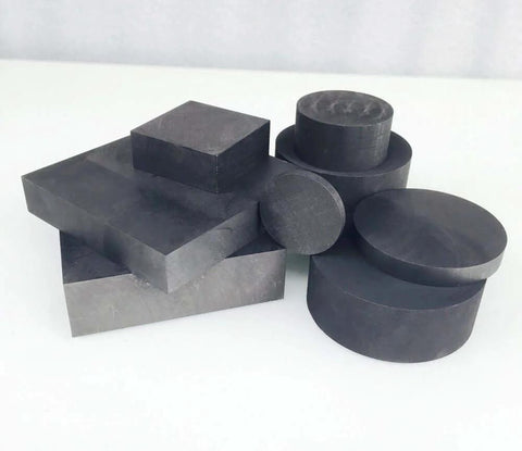 Graphite Ingot Block For EDM And Milling Surfaces Pro Grade 99.9 Percent Purity 75 By 50 Mm Plate stacked with round blocks