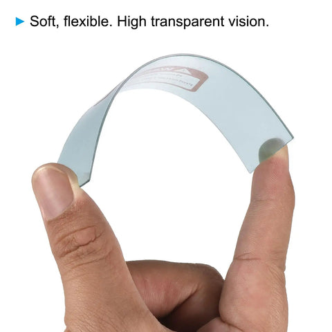 Clear Welding Protection Lenses 4.3 X 3.5 Inch, flexible right angle replacement shield for solar weld helmets, held between fingers.