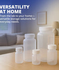 Go To Lab Sample Bottles With Lids Polypropylene 60ml 12 Pack on a table in a home setting with various sizes visible.