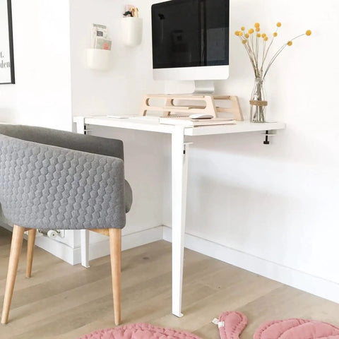 Home office desk setup with 28 inch adjustable metal table legs and bolt fixed platform, modern design with chair and decor.