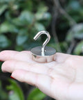 Neosmuk magnetic hook, silver, curved hook, held in hand (close-up)