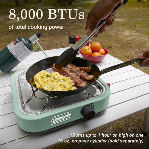 Cooking bacon and eggs on Cascade 18 1-Burner Camping Stove With 8000 BTU Output And Matchless Lighting, outdoors on table.