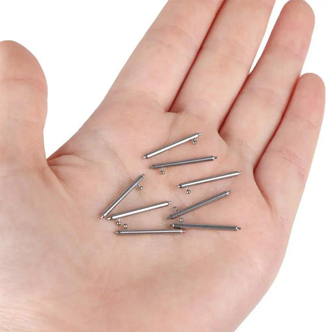 Hand holding Quick Release Watch Spring Bar Pins 20 Piece Set 12Mm 14Mm 16Mm 18Mm 20Mm 22Mm 24Mm Stainless Steel With Watch Strap Repair Tool