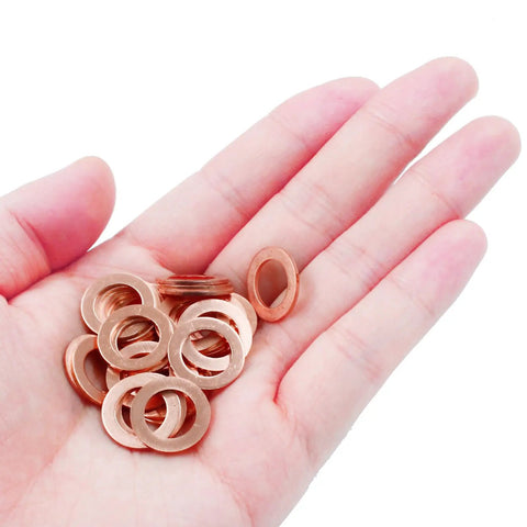 Hand holding 100 Pack M10 Copper Flat Washers Set ID 10mm OD 16mm Sealing Gasket Kit Heavy Duty Copper Washers