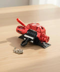 Premium RC Crawler Winch Built With Tough Metal And Precision CNC Parts For Realistic Detailing, featuring a red compact design.