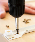 Installing Stainless Steel Drawer Slide Rails 16 Inch, 2 Pack Silent Glide Slides with screwdriver on a wooden surface.