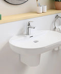 Eurosmart Single Hole Bathroom Faucet Single Handle Chrome Finish 1.2 GPM Flow Includes Nylon Braided Hoses on a white sink