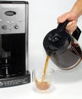 Pouring coffee from 12 Cup Replacement Glass Carafe For A Bunch Of Popular Coffee Makers Fits CHW 12 CHW 12P1 DCC 1100 BK
