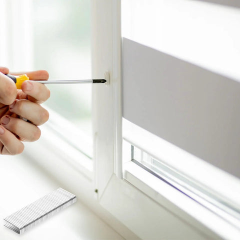 Person using screwdriver to install Heavy Duty Stainless Steel Shutter Louver Staple Repair Kit With Forty Window Shutter Nail Replacement Pieces.