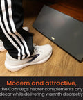 Person using New And Improved Flat Panel Space Heater For Home And Office Portable 150W Heater With Built In Thermostat