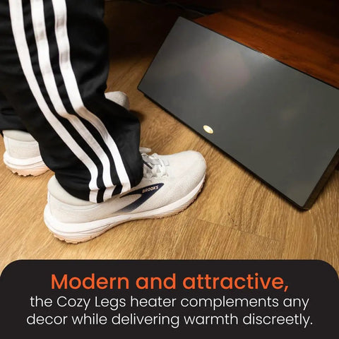 Person using New And Improved Flat Panel Space Heater For Home And Office Portable 150W Heater With Built In Thermostat