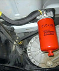 Heavy Duty Diesel Fuel Spin On Filter BF1212 Red For Trucks And Equipment installed in vehicle