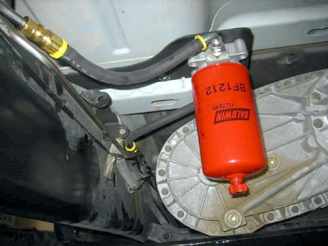Heavy Duty Diesel Fuel Spin On Filter BF1212 Red For Trucks And Equipment installed in vehicle