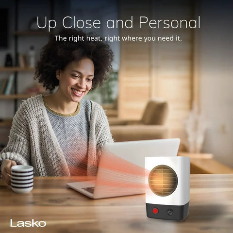 Your Own Mini Personal Ceramic Space Heater For Home And Office, 400W Quick Heat on desk with woman working at laptop